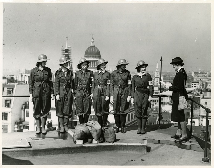 Women Fire Guards practicing on the roof of the Bank, Threadneedle Street 1942 (Archive reference: 15A13/1/4/22)